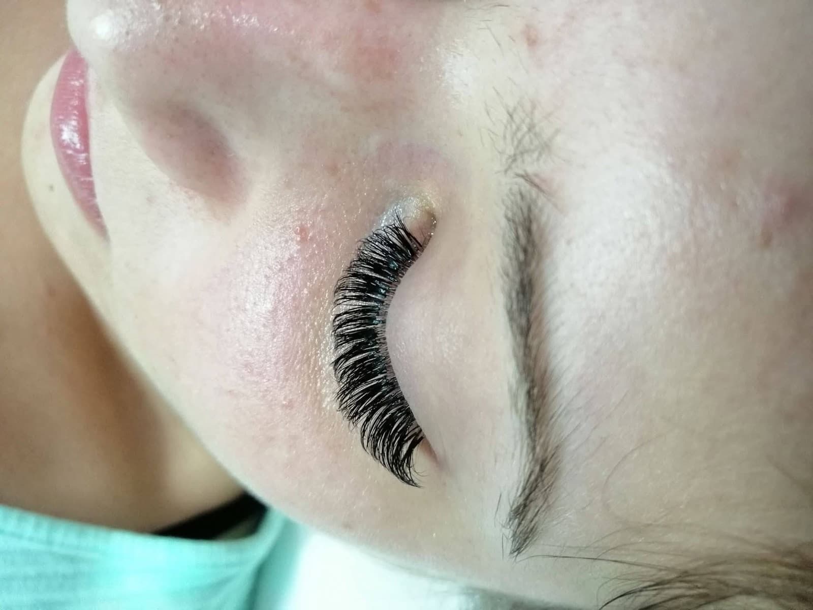 Eyelash extensions with a soft natural curl